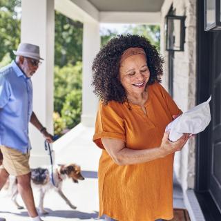 Customer looking at home delivery package